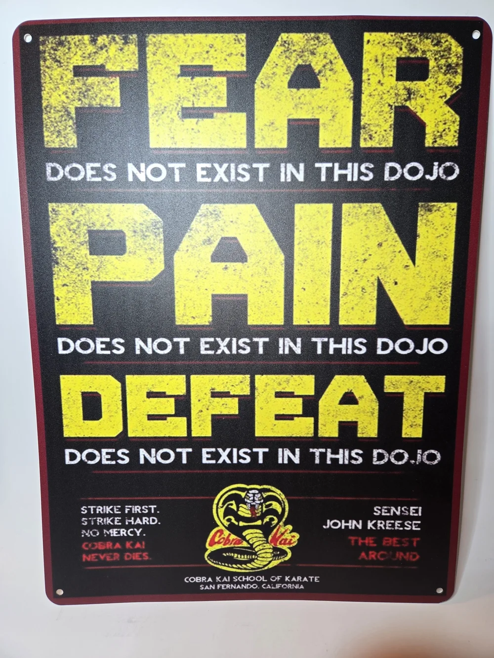 Cobra Kai Metal Sign featuring iconic mottos and the dojo logo as on the TV Show